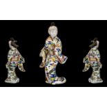 Japanese Antique Imari-Style Figure of a courtesan wearing a flowing gown,