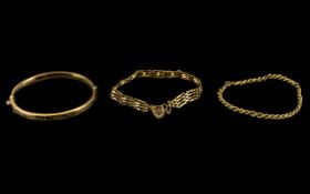 Three Pieces Of 9ct Gold Jewellery To Include A Hinged Bangle With Safety Chain,