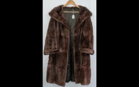 Ladies Musquash Coat in rich brown colour, with shawl collar and turn back cuffs,