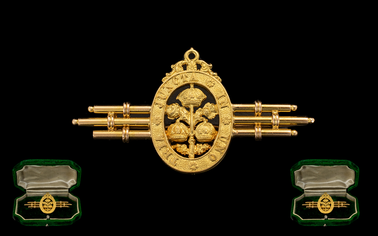18 ct Gold Brooch with Central Badge Containing the Words ' Tria - Juncta Uno' which means 3 in 1.