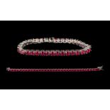 Ruby Tennis Bracelet, 34 round cut rubies of rich, glowing red,