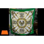 Hermes Vintage Scarf in classic design with green, gold and white background.
