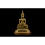 Thai Bronze Buddha, seated on a Lotus plinth wood stand. Height 7.5". Please see images.