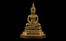 Thai Bronze Buddha, seated on a Lotus plinth wood stand. Height 7.5". Please see images.