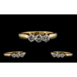 18ct Gold Attractive 3 Stone Diamond Set Ring marked 18ct Gold. The three round brilliant cut