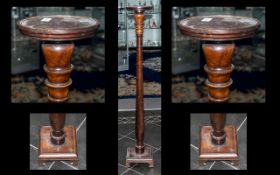 Edwardian Mahogany Torchere Stand with shaped drop column. Terminating on a square base.
