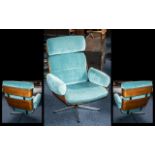 Retro Swivel Armchair by Guy-Rodgers, on a 5 star cruciform base, laminated sides and back.