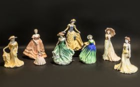 A Collection of Eight Porcelain Figures all boxed.