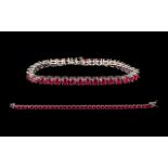 Ruby Tennis Bracelet, 34 round cut rubies of rich, glowing red, each measuring just over half a