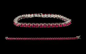 Ruby Tennis Bracelet, 34 round cut rubies of rich, glowing red, each measuring just over half a