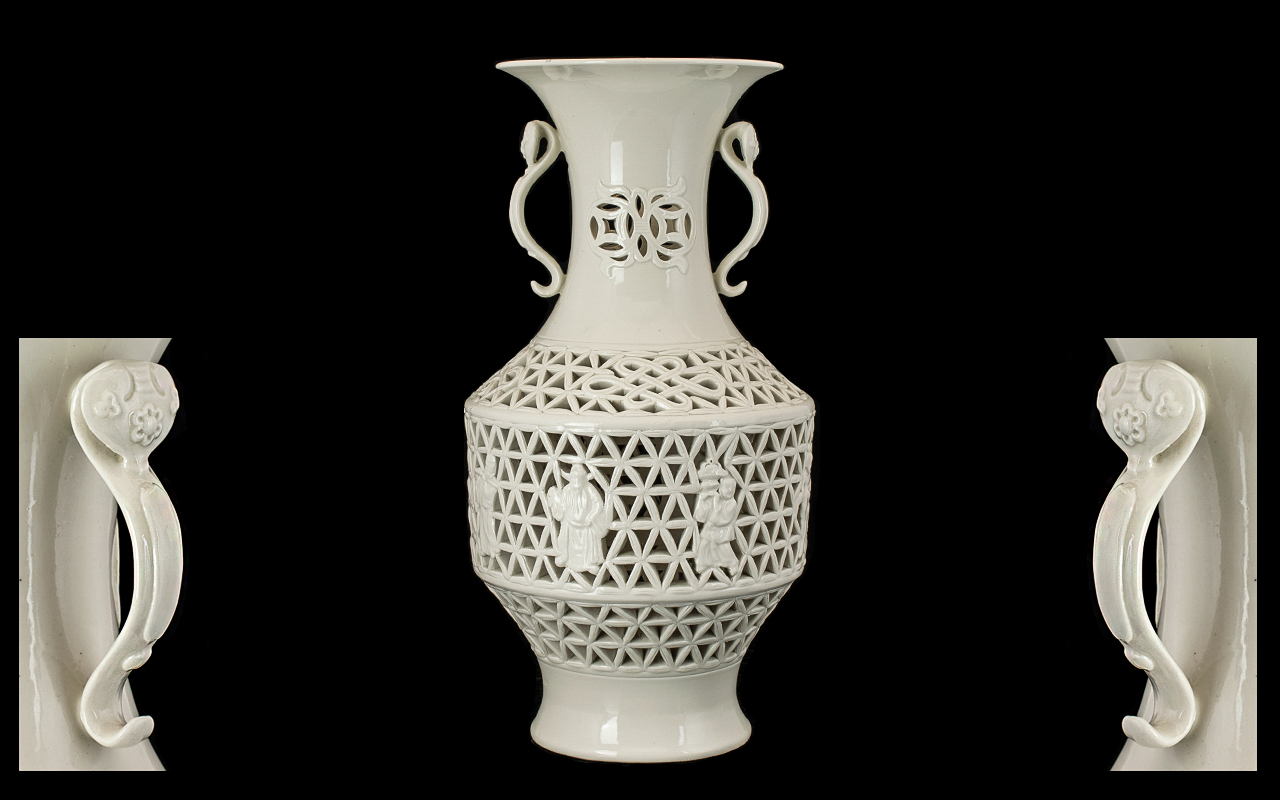 Chinese Blanc-de-Chine Reticulated Vase finely potted and with detailed decorations depicting