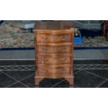 Small Reproduction Mahogany Serpentine Fronted Chest of Drawers with graduated drawers with fitted