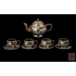 Chinese Brown Pottery Tea Set inlaid with Pewter applied decorations of a coiling dragon.