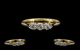 18ct Gold and Platinum Petite 3 Stone Diamond Ring - Illusion Setting. Marked 18ct & Platinum. The