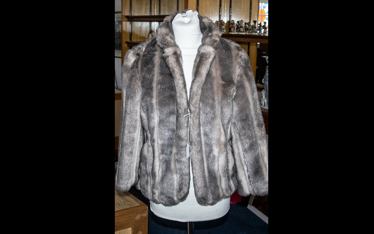 Ladies Faux Fur Jacket hip length, hook and eye fastening, faux mink in taupe brown colour. Approx