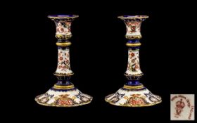 Royal Crown Derby Pair of Candlesticks - date 1899. Hairline crackes to both bases.