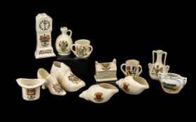 A Small Collection of Crested Ware to include a top hat, boot, grandfather clock, tyg,