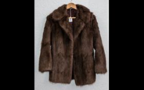 Ladies Fur Jacket. Collar and reveres, two slit pockets, half belt to back.