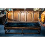 Antique Oak Settle with an arched raised panel back,