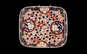 Imari Square Shaped Dish of typical palette, Meiji period. Decorated with birds in the roundels.