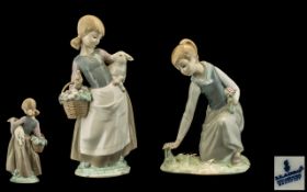 Lladro Porcelain Figures (2) - 1) Girl gathering flowers model no. 1172. Issued 1971-1993. Height 8.