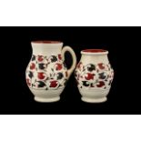 Crown Ducal Jug and matching decorative pot. Red and black pattern on cream ground.
