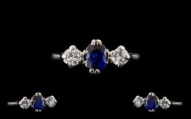 Platinum Set Nice Quality 3 Stone Diamond and Sapphire Ring of pleasing form, circa 1950's. The