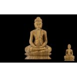 Oriental Carved Wood Figure of a Seated Buddah Figure - wearing a toga. 14" high, 9" wide.