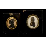 Two 19thC Silhouettes with gilt highlights both in gilt metal mounts with black lacquered frames.