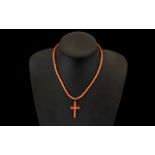 1920's Coral Beaded Necklace with Cross - 18" - 45 cm long. Plus a carved bone religious figure.