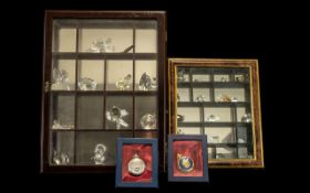 Collection of Crystal Minatures housed in two display cases, including owls, castle, fish, birds,