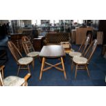 Ercol Elm Golden Dawn Dining Room Set comprising an oval drop-leaf table with four Windsor back