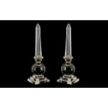 Pair Large Glass Obelisks, mounted on a sphere on stepped base of unusual form and unsigned.