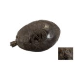 An 18thC Dutch Colonial Carved Coconut Shell 'Beast' Water Flask carved to the body with swags and
