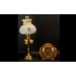 A Duplex Brass Oil Lamp with glass shade. Made in England. Measuring 21 inches in height.