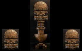 A Large Carved Peruvian Totem depicting an Aztec god fitted on a step base 36 inches high.