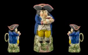 Staffordshire Antique Pratt Ware Style Toby Jug of small size with Toby holding a Jug of Ale with