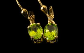 Peridot Solitaire Drop Earrings, oval solitaires of bright green peridot, each of 1.