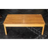 Ercol Elm Coffee Table of traditional form, raised on four tubular legs. Length 42", Width 21.