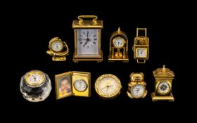 A Good Collection of Gold Gilt and Brass Miniature Clocks.