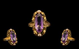 14ct Gold Attractive Single Stone Amethyst Set Ring, Well Designed Setting. The Elongated Faceted
