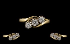 18ct Yellow and White Gold 3 Stone Diamond Set Ring of Excellent Design and Form. Fully Hallmarked