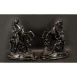 Two Metal Figures of Rearing Horses each with figure of man holding the bridle.