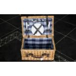 Wicker Picnic Basket with leather handle and straps, lined in blue checked fabric with two plates,
