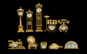 A Collection of Good Quality Gold Gilt Brass Miniature Clocks.