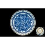 Chinese Blue & White Shallow Dish Arabesque design to the interior with clouds to the exterior.