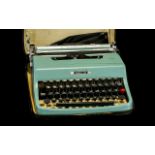 Portable Olivetti Lettra 32 Portable Typewriter - in case with original cover. Appears to be fully