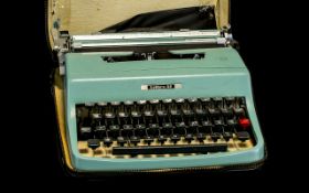 Portable Olivetti Lettra 32 Portable Typewriter - in case with original cover. Appears to be fully