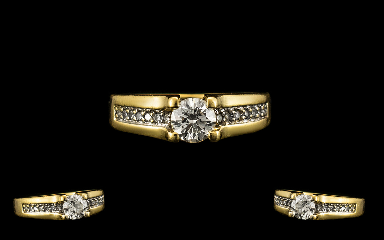 18ct Yellow Gold Attractive Diamond Set Ring the central round brilliant cut diamond of excellent