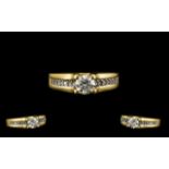 18ct Yellow Gold Attractive Diamond Set Ring the central round brilliant cut diamond of excellent